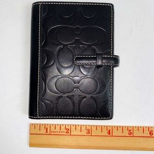 Coach like new black embossed leather passport holder